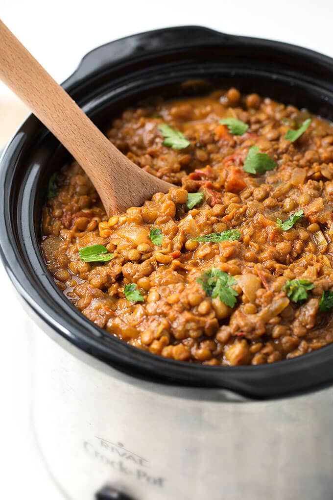  Crock Pot Curry Lentils in a crock pot with wooden serving spoon