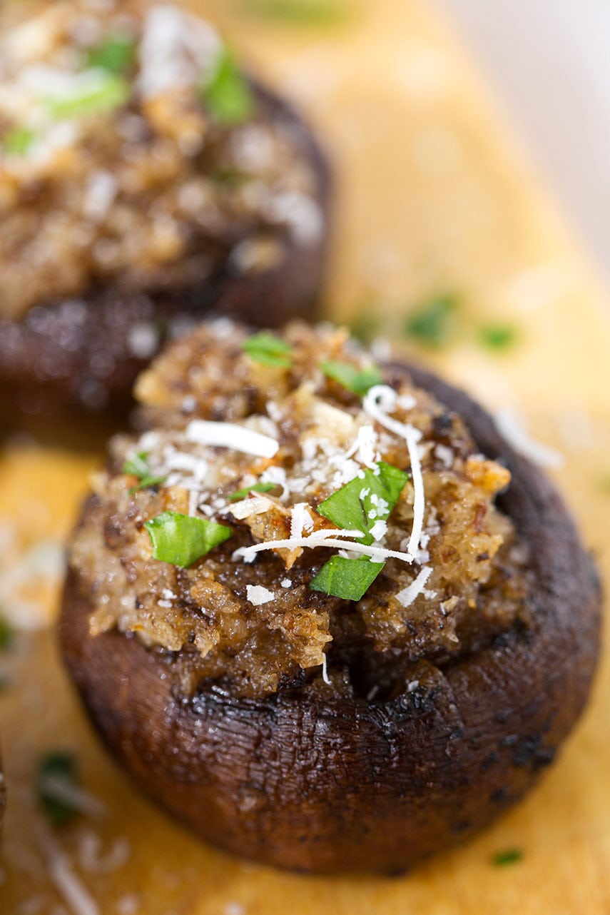 Close up of a Easy Garlic Stuffed Mushrooms on wooden board