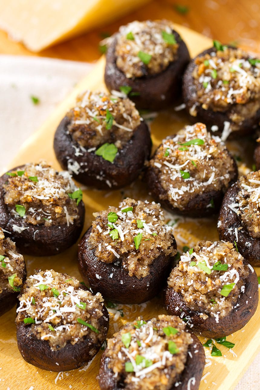 Several Easy Garlic Stuffed Mushrooms on a wooden board