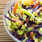 Bowl of Fresh Asian Slaw on a bamboo mat