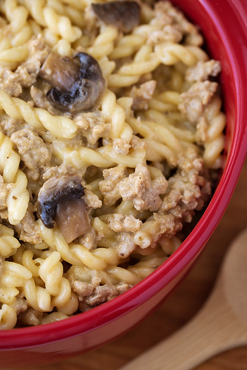 Close Up of Instant Pot Cheeseburger Pasta in red bowl