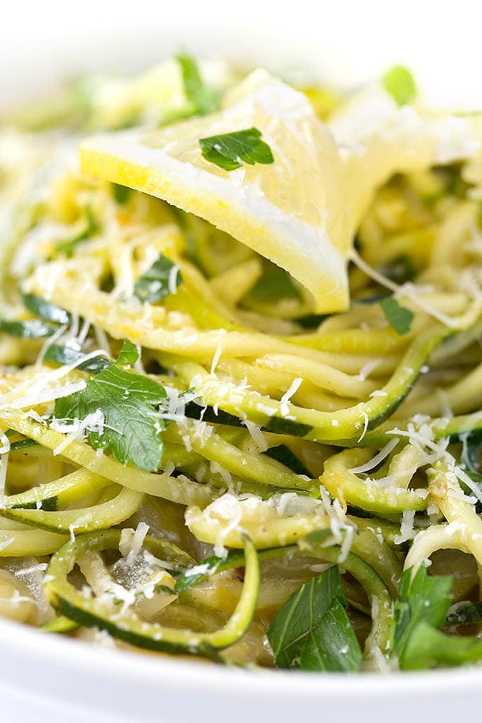 close up of Lemon Garlic Zucchini Noodles in a white bowl