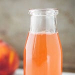 Peach Simple Syrup in a glass jar