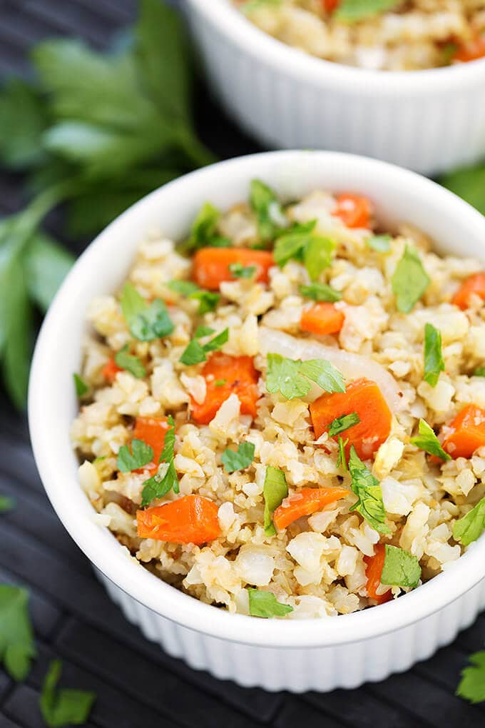 Roasted Cauliflower Rice with Carrots in a small white bowl