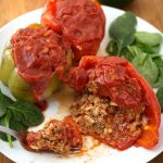 Instant Pot Stuffed Peppers are a great weeknight meal. A classic dinner of pressure cooker stuffed peppers in under an hour! simplyhappyfoodie.com #instantpotrecipes #instantpotstuffedpeppers #pressurecookerstuffedpeppers