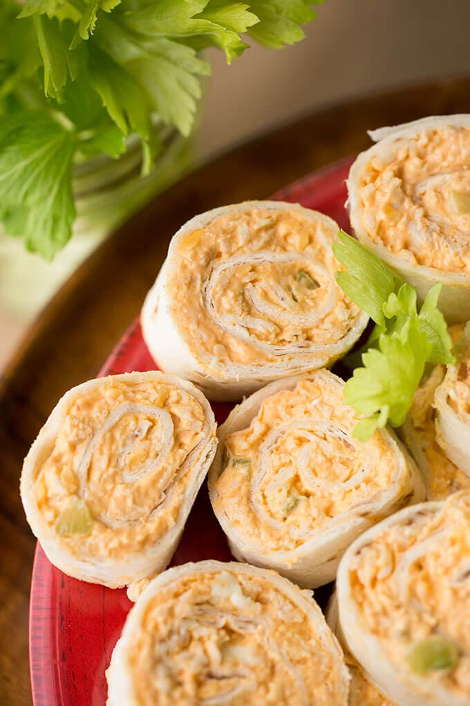 Several Buffalo Chicken Pinwheels on red plate