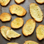 Several Crostini on metal baking sheet