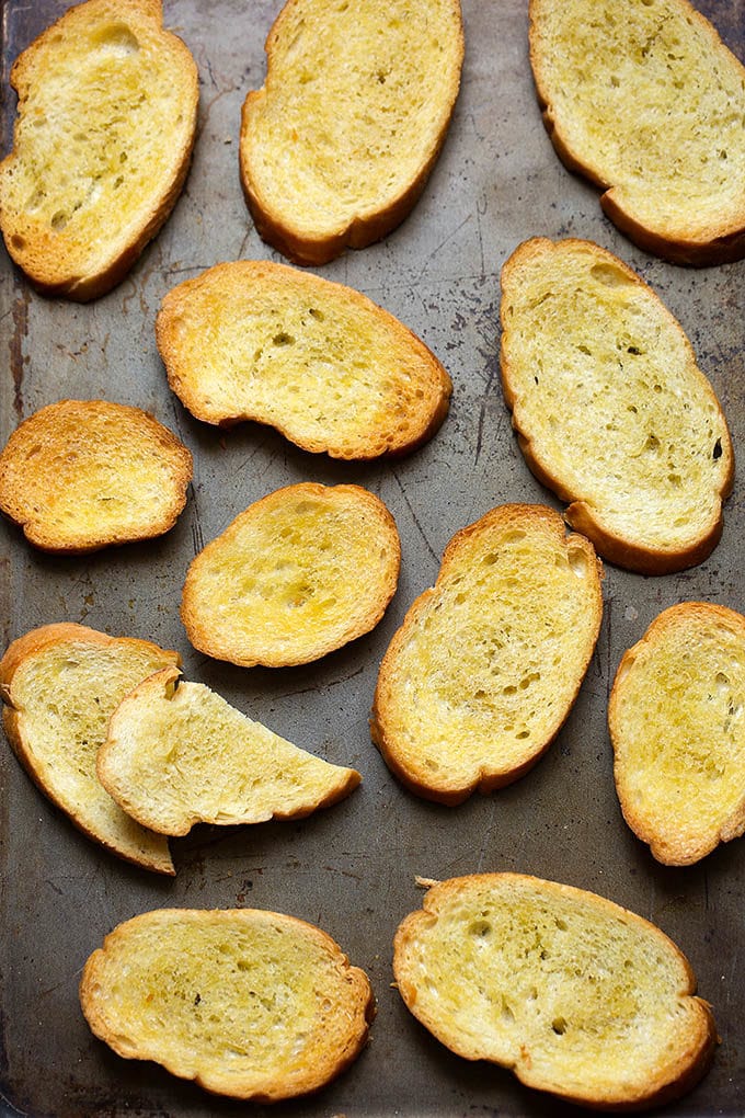 Several Crostini on metal baking sheet