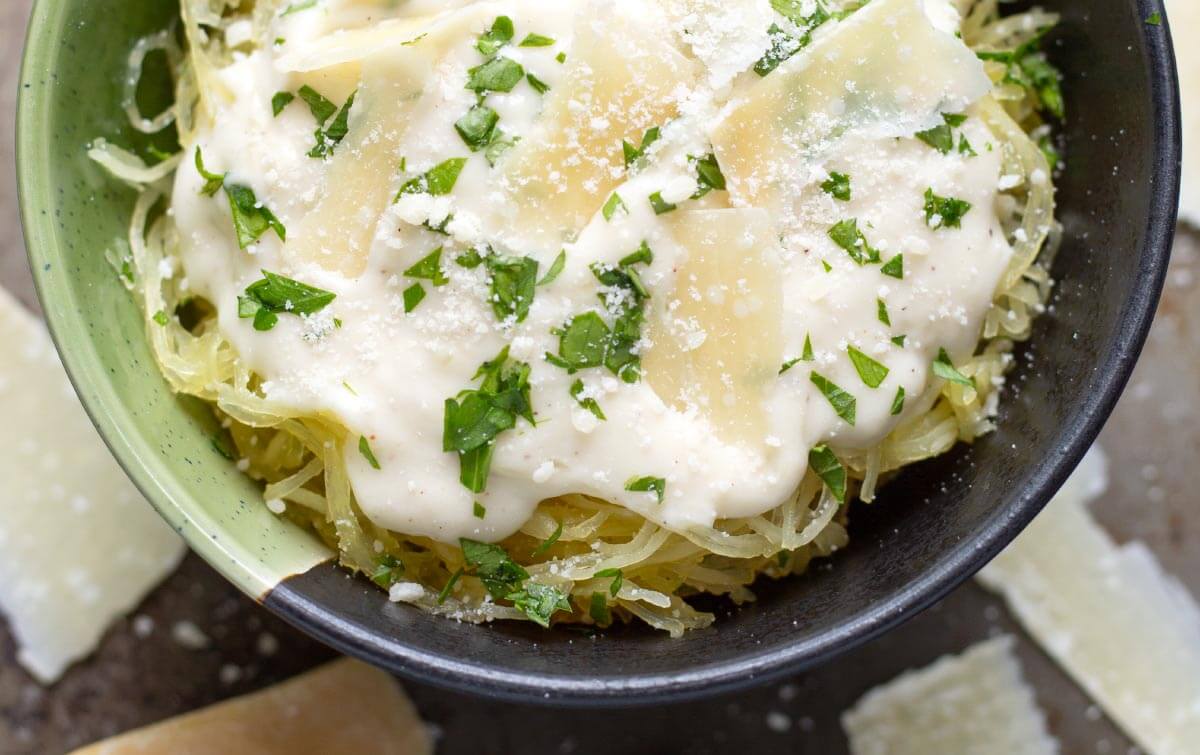 Garlic Parmesan Cream Sauce on spaghetti squash in bowl.