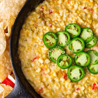 Hot Cheesy Corn Dip is a flavorful game day and party favorite. With corn, green chilis and cheese, we love this dip. simplyhappyfoodie.com #corndip #gameday #appetizer