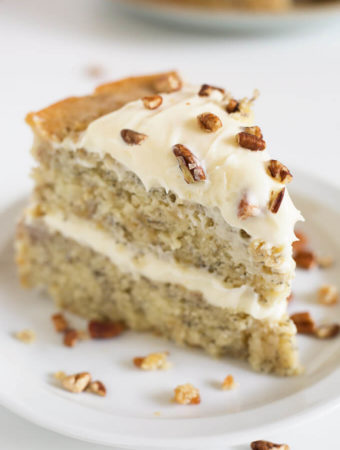 Slice of banana cake on white plate