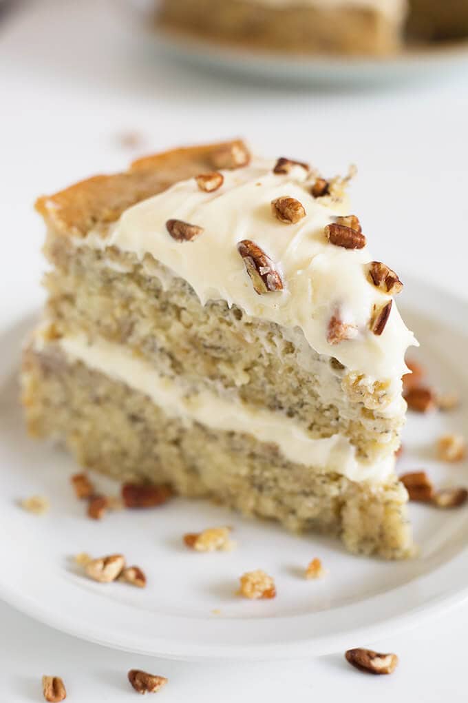 Slice of banana cake on white plate