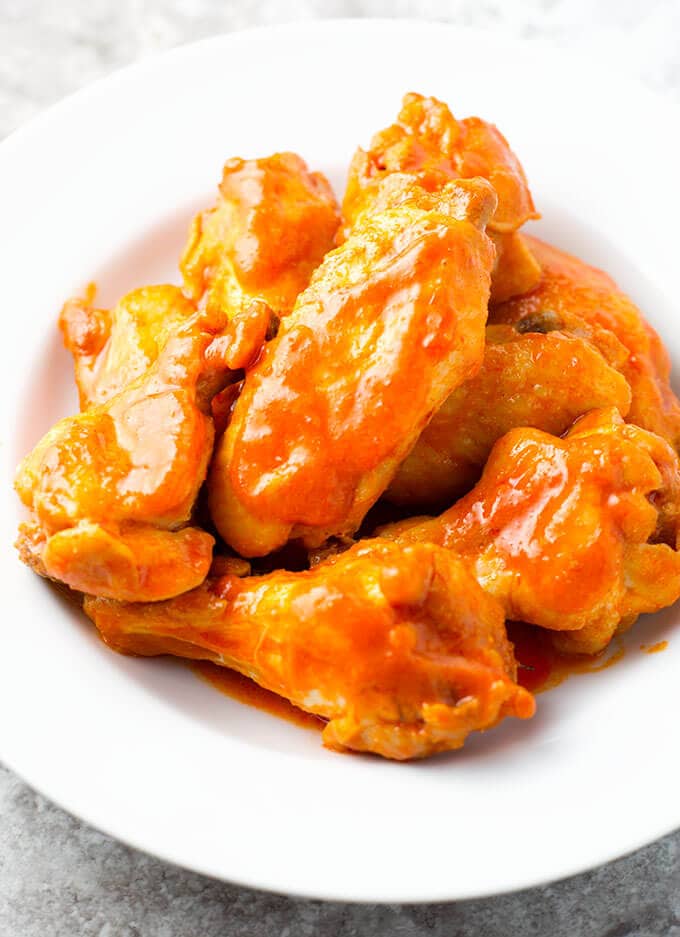 Buffalo chicken wings in white bowl