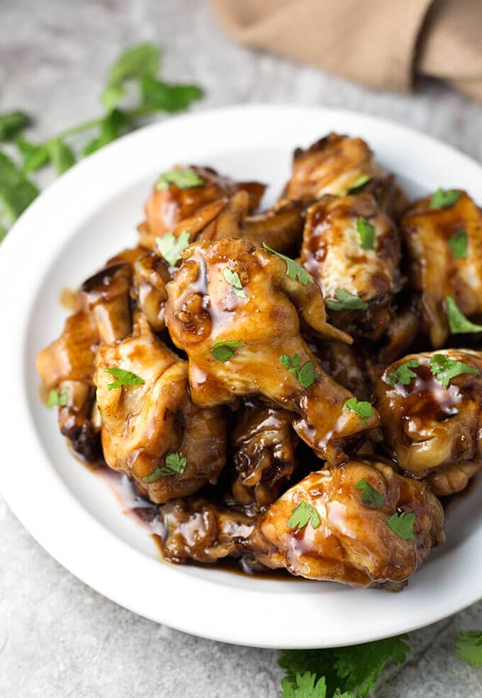 Teriyaki wings on white plate 