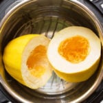 Instant Pot Spaghetti Squash cut in half on trivet in pressure cooker