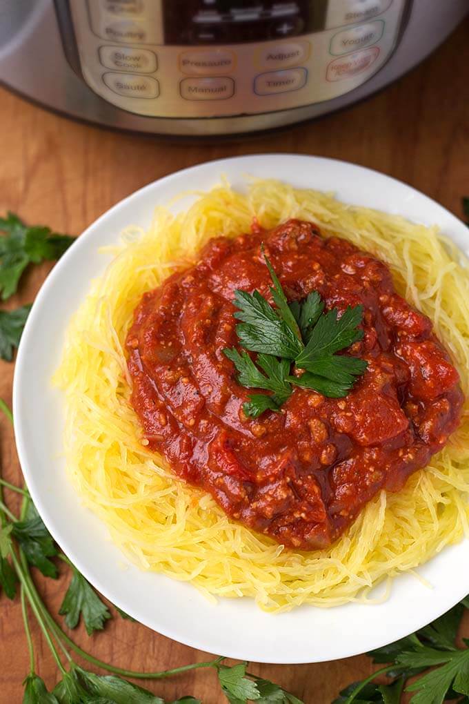  Spaghetti Squash topped with marinara sauce on white plate