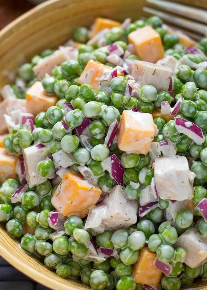 Close up of Pea Salad with Smoked Turkey in dark yellow bowl