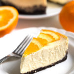 Slice of Pressure Cooker Dreamy Orange Cheesecake on a white plate with fork