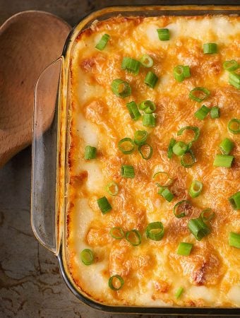 Cheesy Baked Orzo in a glass casserole dish