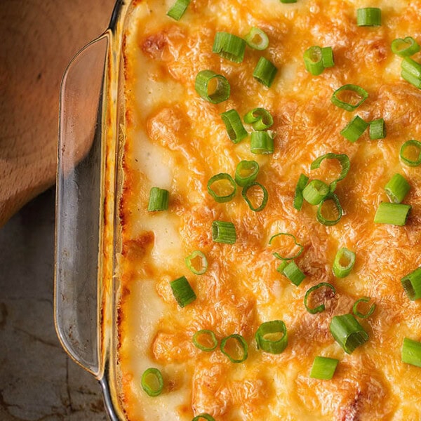 Cheesy Baked Orzo in a glass casserole dish