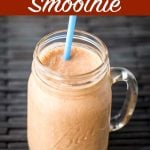 Peanut Butter Banana Smoothie in glass with straw.