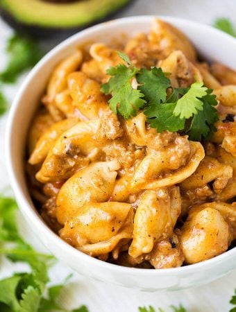 Instant Pot Cheesy Taco Pasta in a white bowl