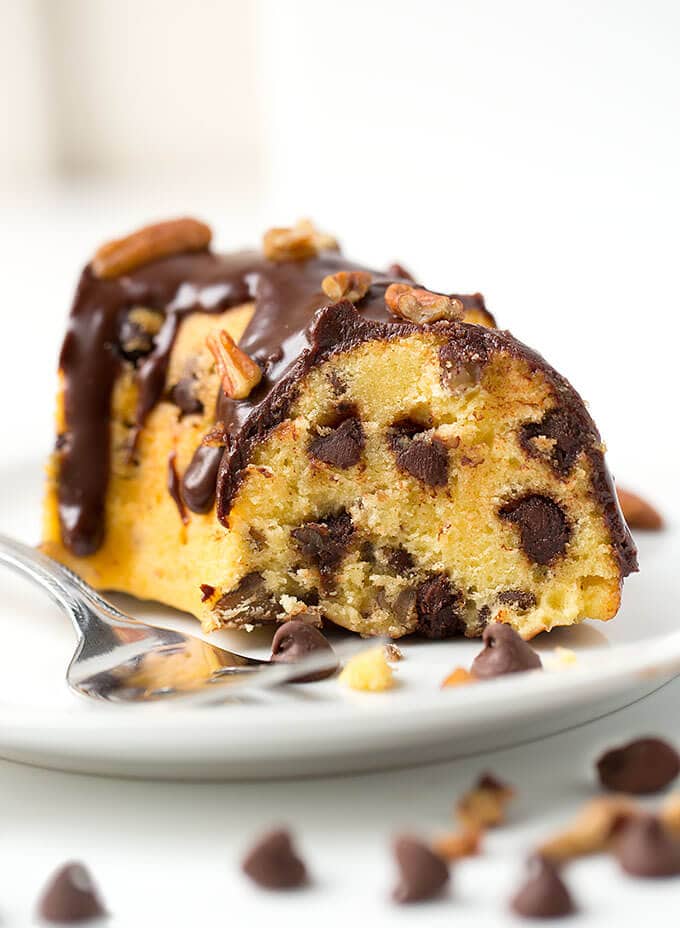 Slice of Pecan Chocolate Chip Cake on white plate