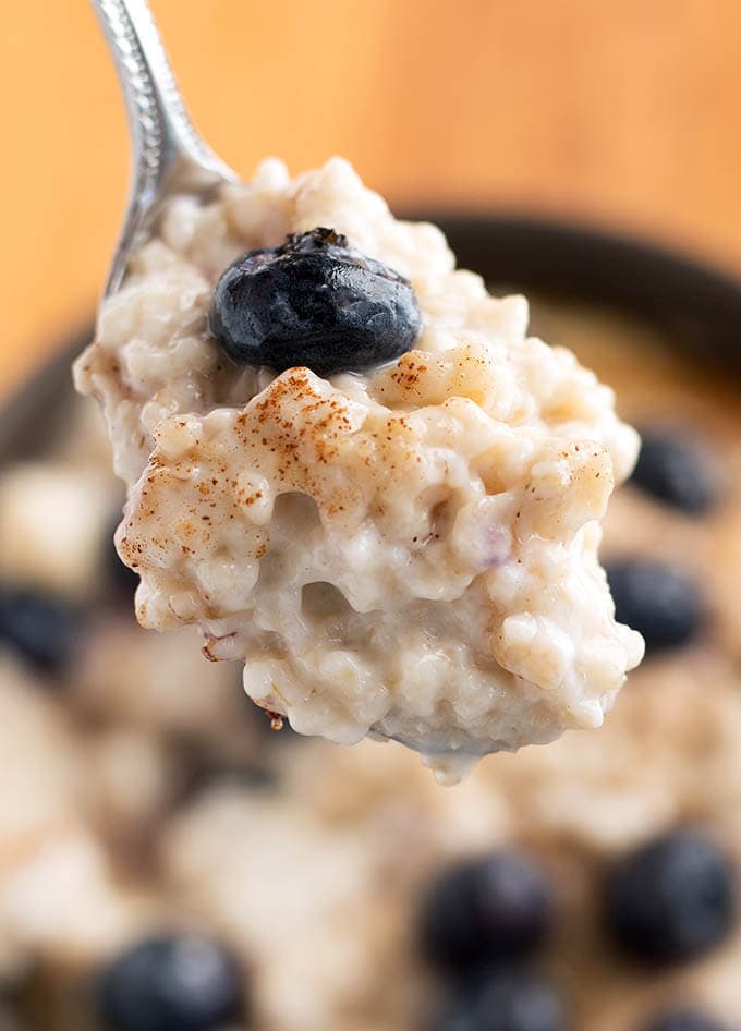 Close up of silver spoon with Steel Cut Oats 