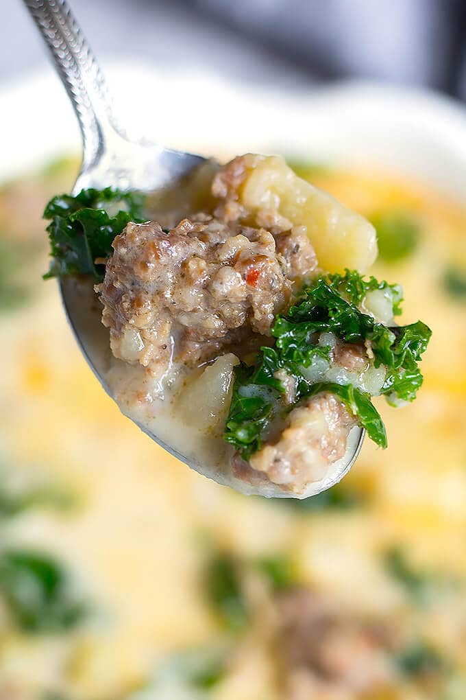 Close up of spoonful of Zuppa Toscana