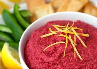 Red Beet Hummus in white bowl.