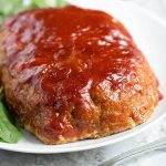 This Tasty Turkey Meatloaf is flavorful and juicy. Easy to make and the family will love it! simplyhappyfoodie.com #meatloaf #turkeymeatloaf #bestmeatloaf #meatloafrecipes