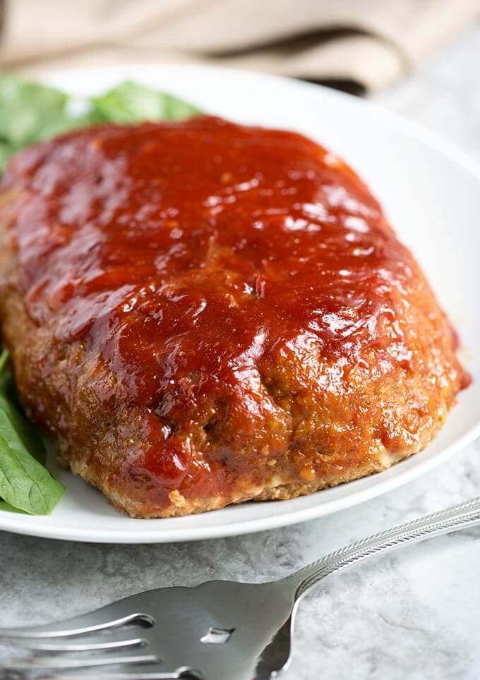 Tasty Turkey Meatloaf on a white plate next to silver fork