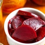 Pickled beets in small white bowl
