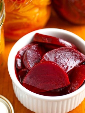 Pickled beets in small white bowl