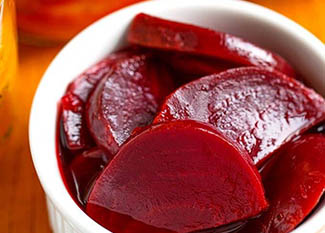 pickled instant pot beets in a small white bowl.