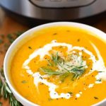 Instant Pot Butternut Squash Soup in a white bowl in front of the IP