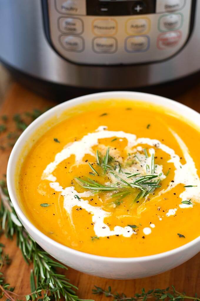 Instant Pot Butternut Squash Soup in a white bowl in front of the IP