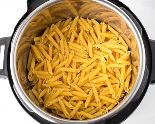 Dried pasta in pressure cooker pot