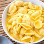 Instant Pot Mac and Cheese is simple, creamy, cheesy, and delicious. Make this fast in your electric pressure cooker, and in one pot! simplyhappyfoodie.com #instantpotmacandcheese #instantpotrecipes #instapot
