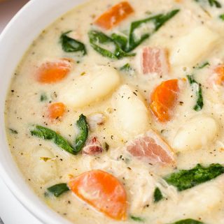 Creamy Chicken Gnocchi Soup is rich and full of Italian flavor! It is easy to make and goes well with crusty bread. simplyhappyfoodie.com #chickengnocchisoup #gnocchi