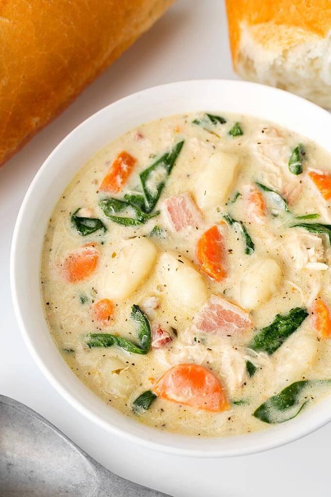 Creamy Chicken Gnocchi Soup in a white bowl on a white background