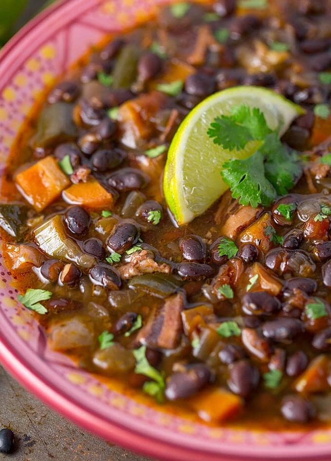 close up of Instant Pot Black Bean Soup in a colorful bowl