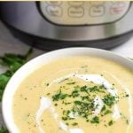 Instant Pot Potato Leek Soup in a white bowl in front of IP.
