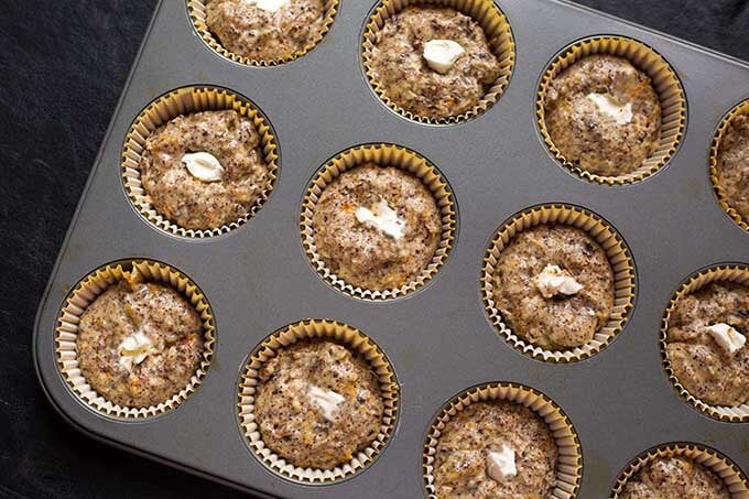 uncooked Orange Chocolate Cream Cheese Muffins in a muffin pan