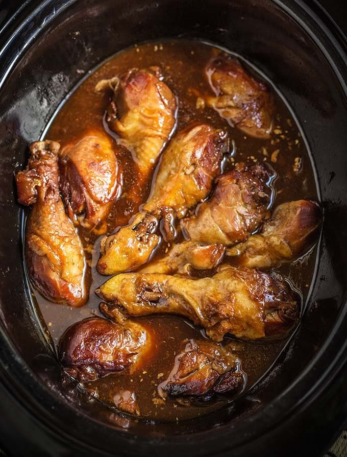 Sticky Chicken Drumsticks in a black crock pot