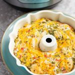 Instant pot southwest biscuit egg bake in a white bunt pan on top of a turquoise plate