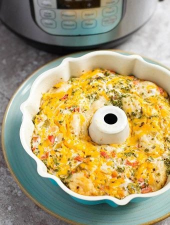 Instant pot southwest biscuit egg bake in a white bunt pan on top of a turquoise plate