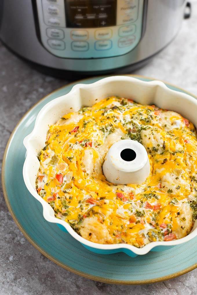 Instant pot southwest biscuit egg bake in a white bunt pan on top of a turquoise plate