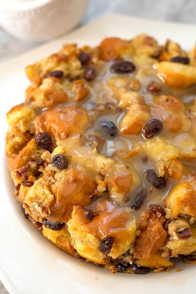 Instant Pot Bread Pudding is a rich and creamy Holiday dessert. Make this pressure cooker bread pudding any time of the year! simplyhappyfoodie.com #instantpotrecipes #instantpotbreadpudding #pressurecookerbreadpudding