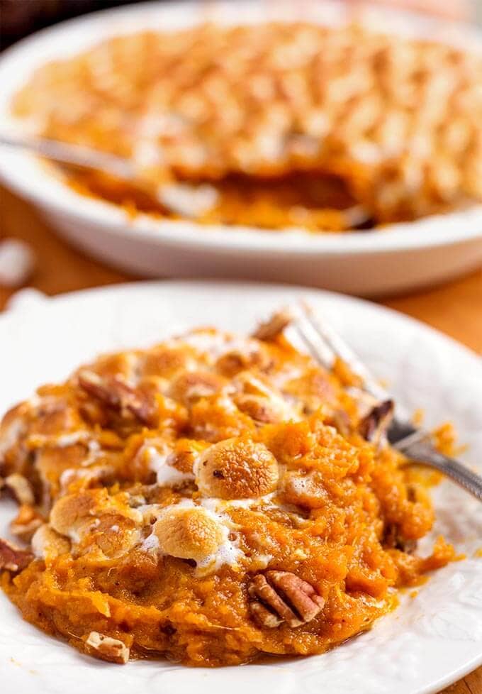 Instant Pot Candied Yams on a white plate with silver fork